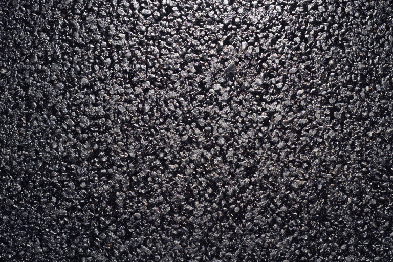 Texture of fresh and new black asphalt. Background of new asphalt.